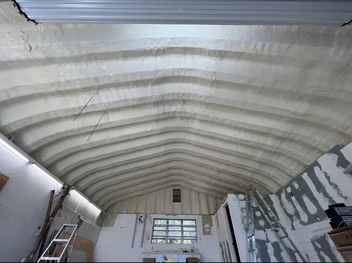 Spray polyurethane foam applied to the underside of a metal roof deck in Meadow Woods